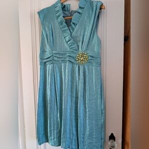 Elegant Blue Sleeveless Dress with Brooch